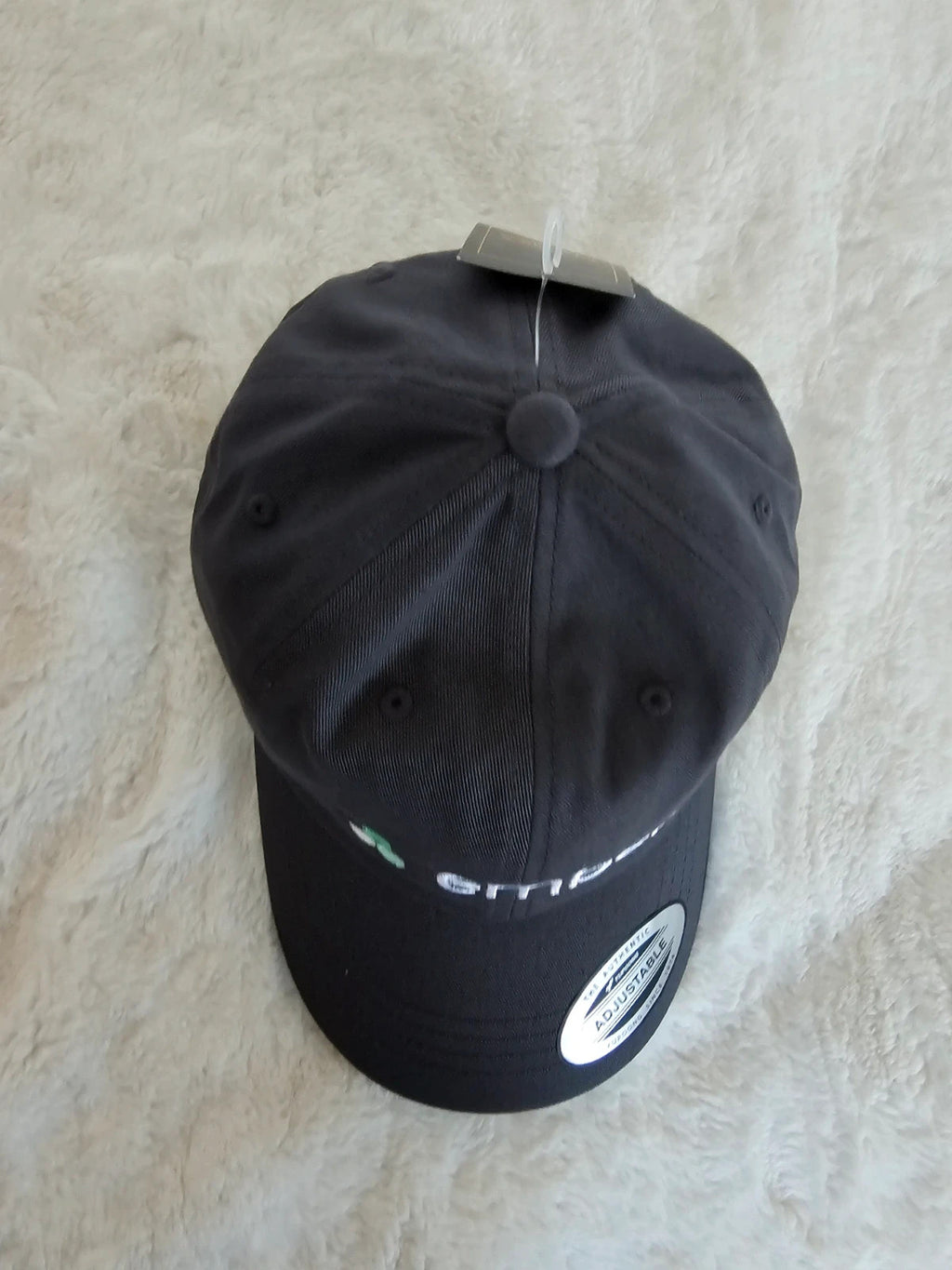 The Classics grey dad hat adjustable straps embroidered logo cotton material.