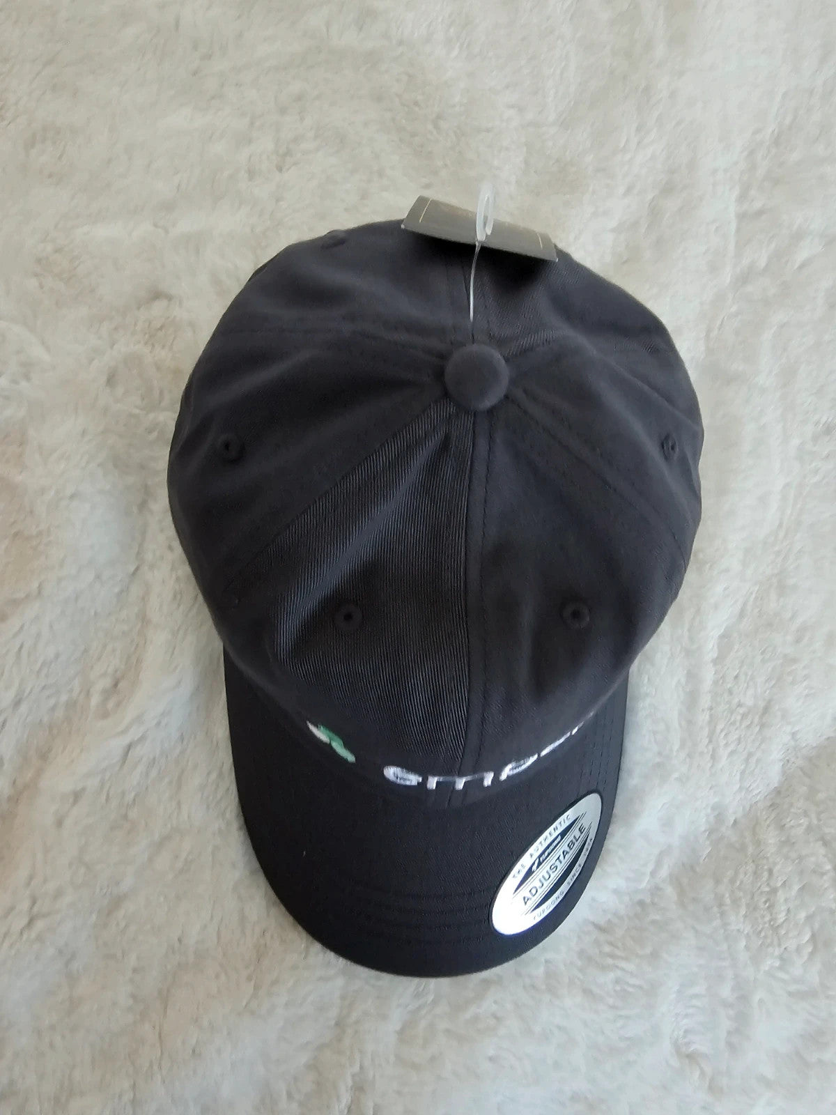 The Classics grey dad hat adjustable straps embroidered logo cotton material.