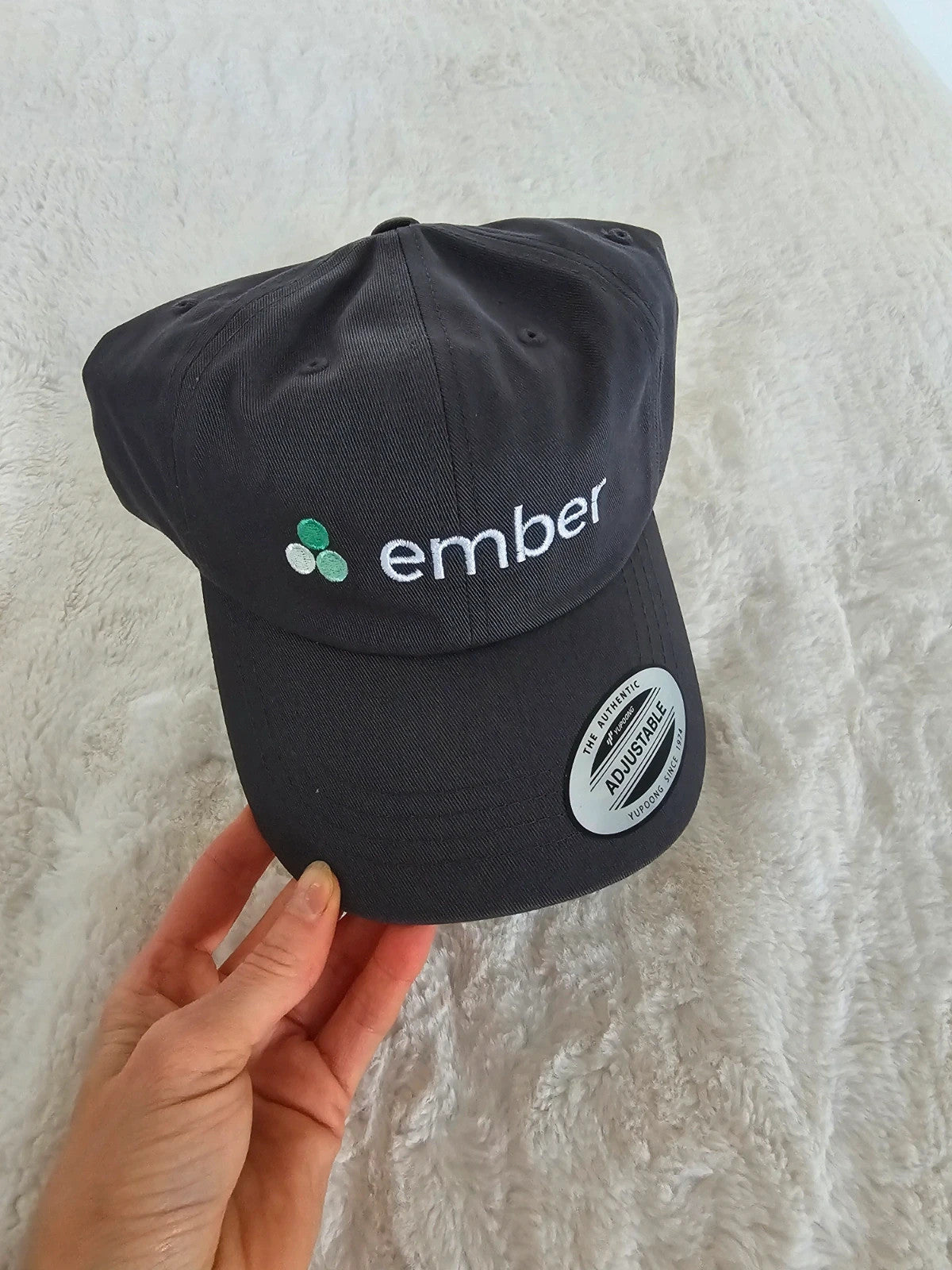 The Classics grey dad hat adjustable straps embroidered logo cotton material.