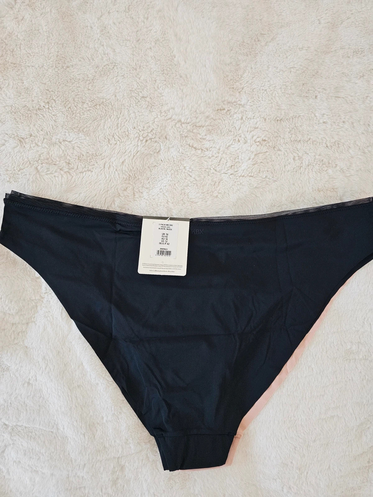 Knickerbox beige and black lace high leg briefs with seamless design and tag.