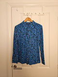 Ruth Langsford blue and black leopard print blouse with collar and button details.