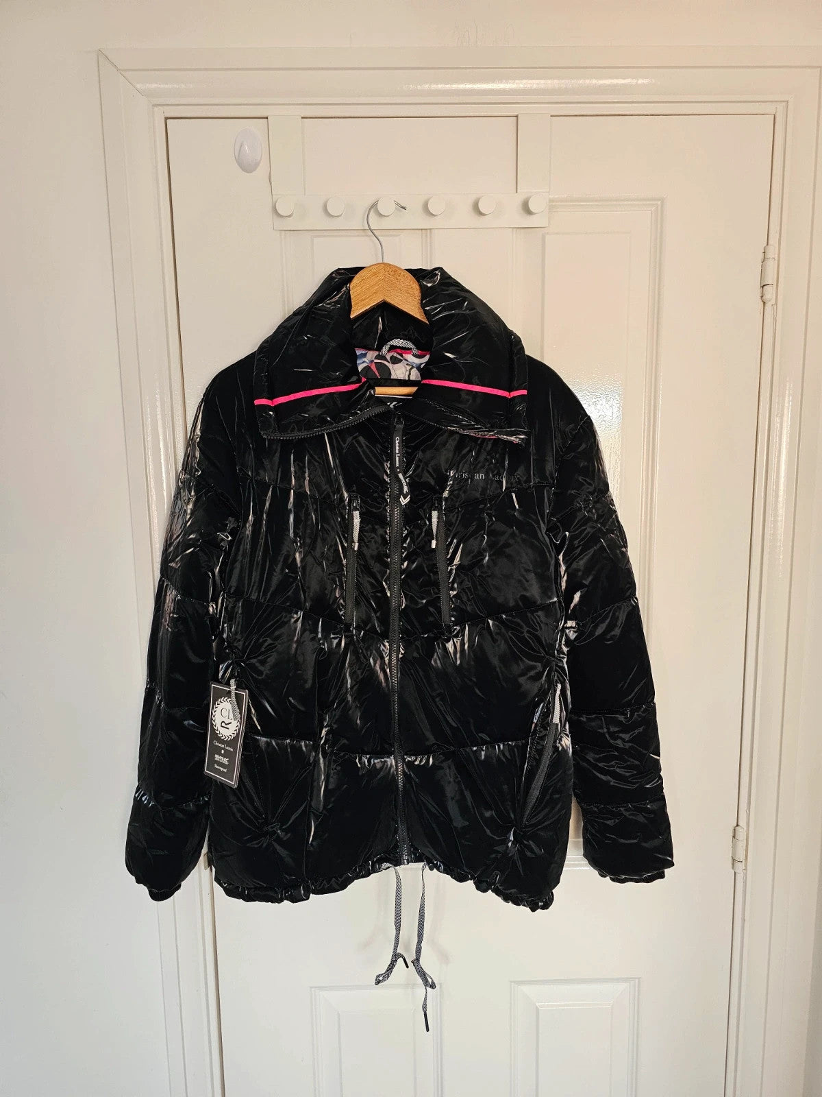 Christian Lacroix black puffer jacket quilted design with waterproof finish and inner pocket.