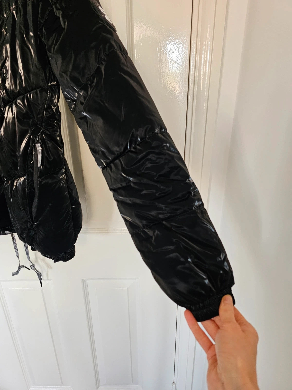 Christian Lacroix black puffer jacket quilted design with waterproof finish and inner pocket.
