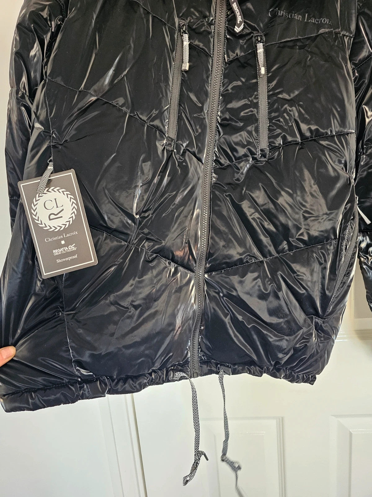 Christian Lacroix black puffer jacket quilted design with waterproof finish and inner pocket.