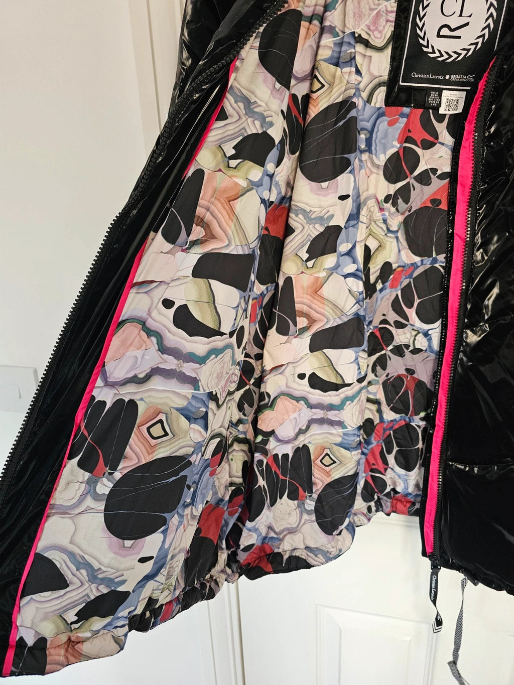 Christian Lacroix black puffer jacket quilted design with waterproof finish and inner pocket.