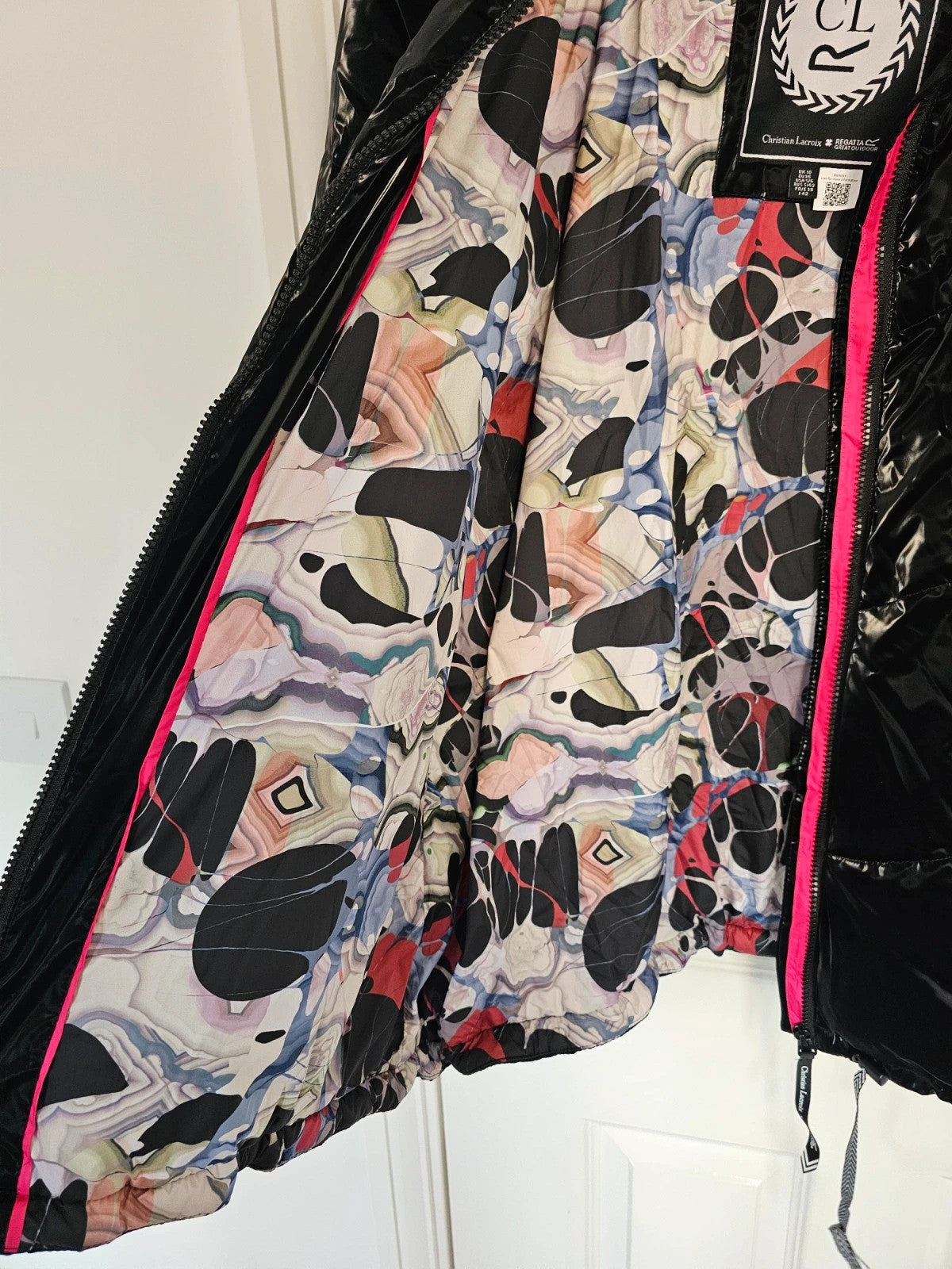 Christian Lacroix black puffer jacket quilted design with waterproof finish and inner pocket.
