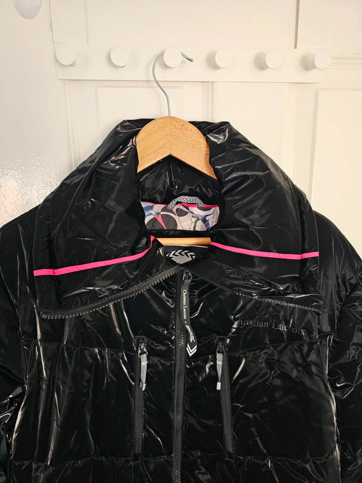 Christian Lacroix black puffer jacket quilted design with waterproof finish and inner pocket.