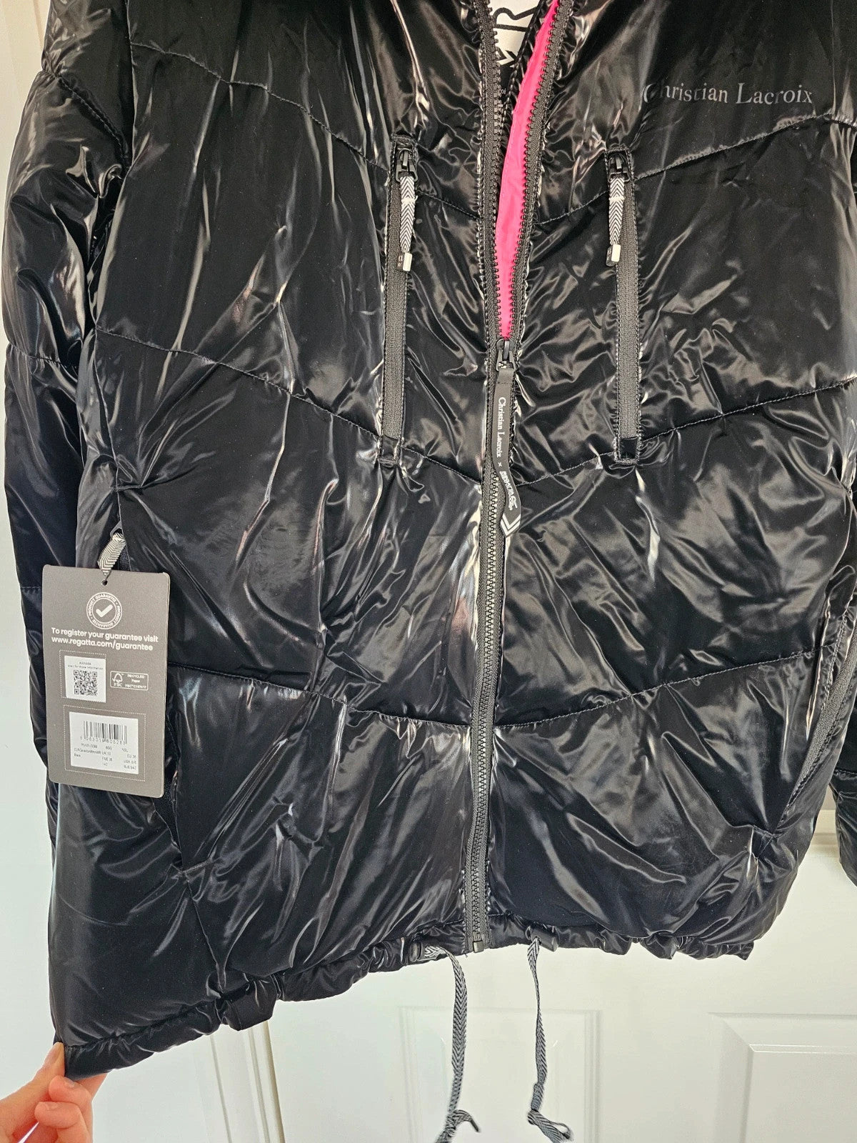 Christian Lacroix black puffer jacket quilted design with waterproof finish and inner pocket.