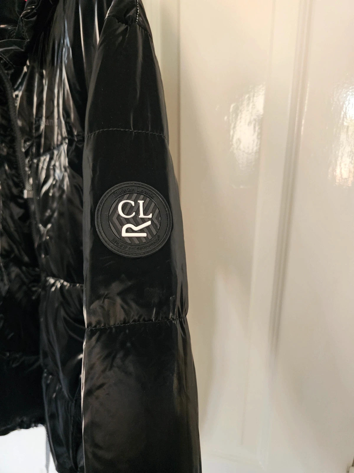 Christian Lacroix black puffer jacket quilted design with waterproof finish and inner pocket.