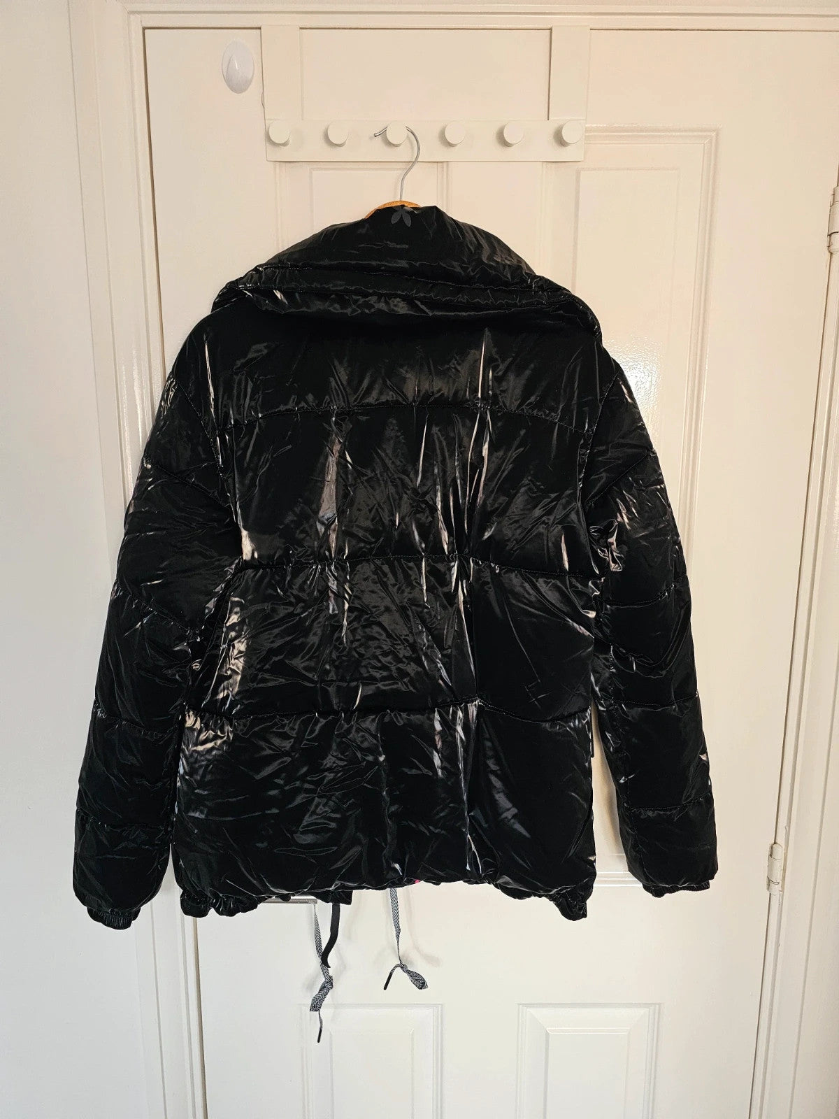Christian Lacroix black puffer jacket quilted design with waterproof finish and inner pocket.