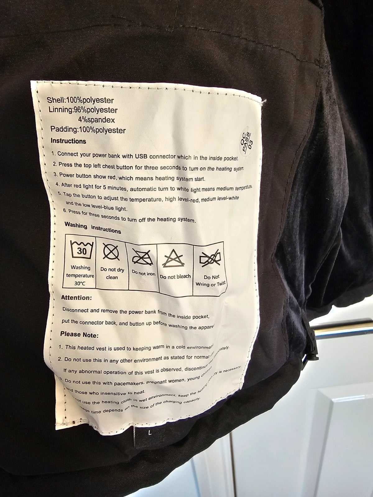 Generic black heating gilet sleeveless jacket with USB electric feature, thermal material.