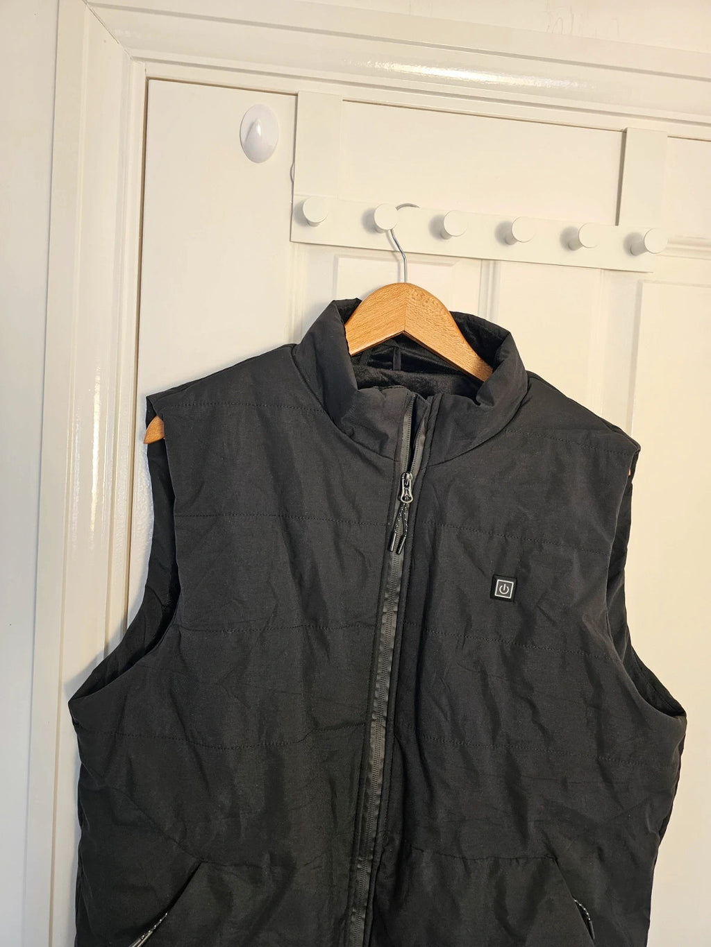 Generic black heating gilet sleeveless jacket with USB electric feature, thermal material.