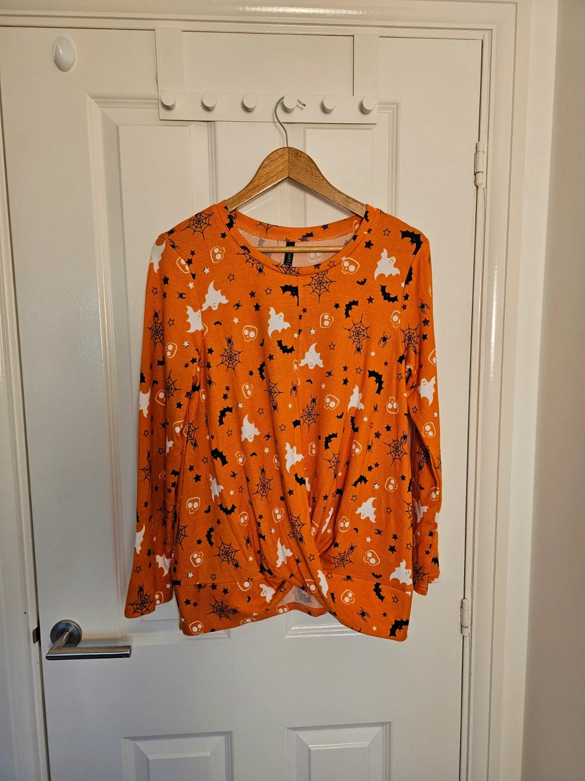 Hot Gift black and orange Halloween jumper with spider ghost skull print and twist hem.