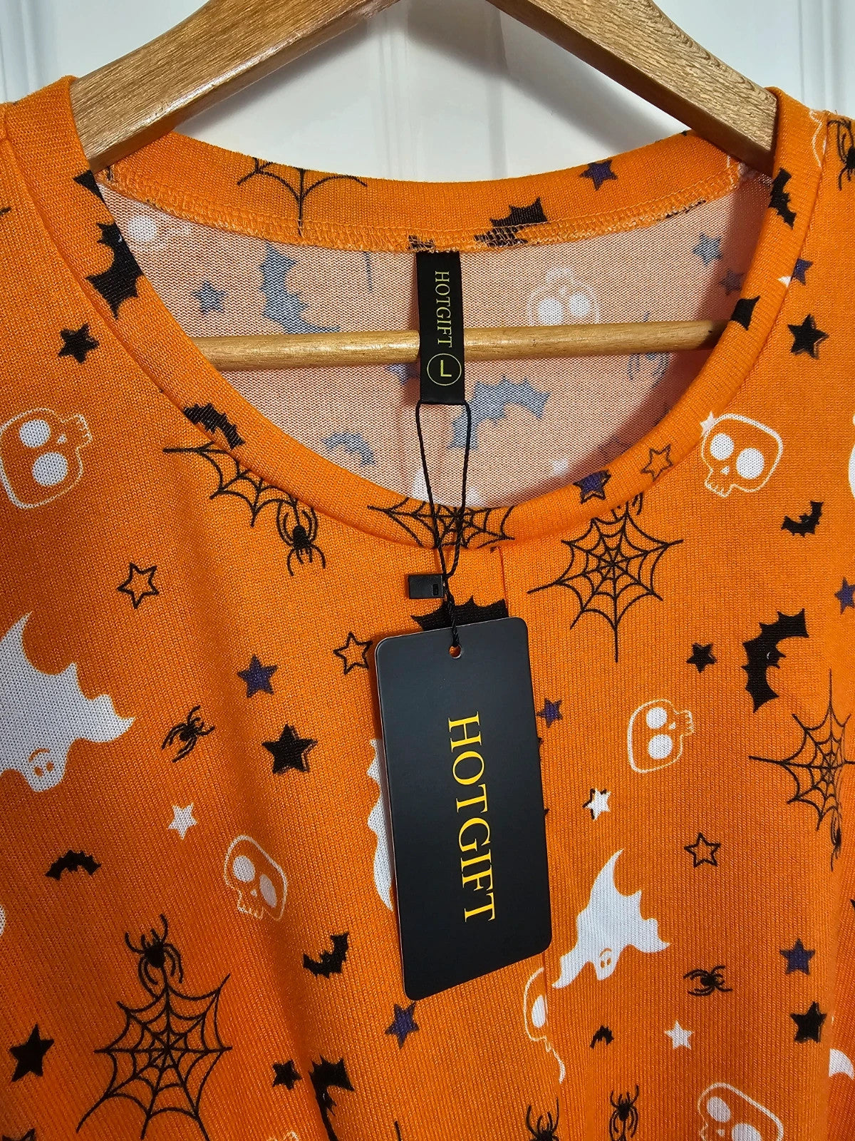 Hot Gift black and orange Halloween jumper with spider ghost skull print and twist hem.