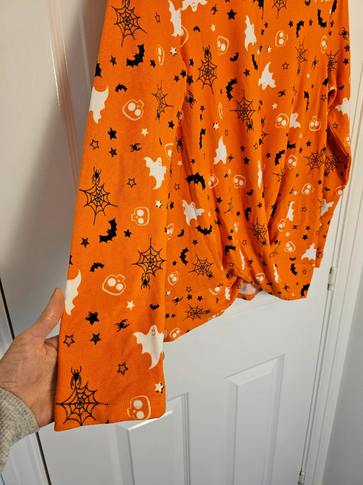 Hot Gift black and orange Halloween jumper with spider ghost skull print and twist hem.