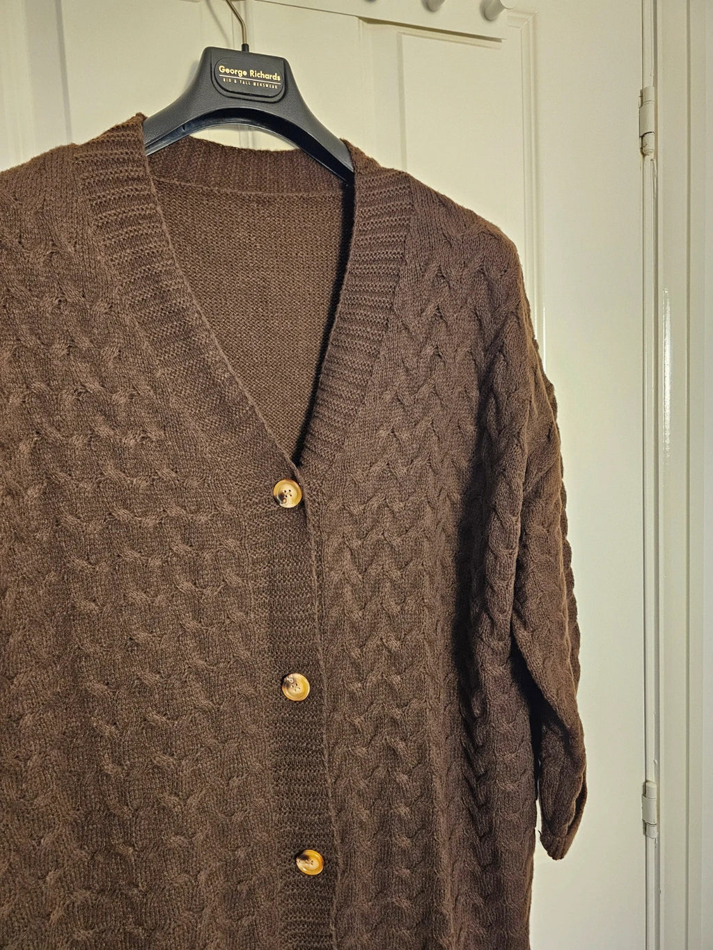 Shein Curve brown knit cardigan with drop shoulders, long sleeves, and button details.
