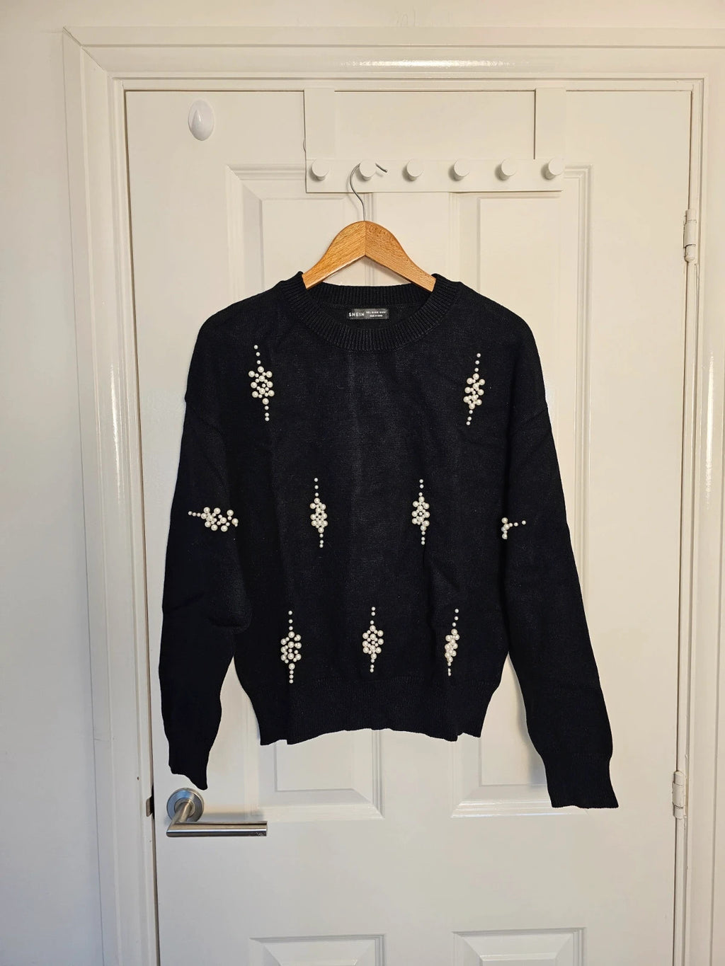 SHEIN black knit jumper with pearl studs and crew neck design.