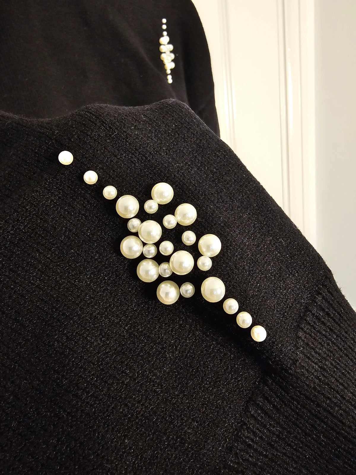 SHEIN black knit jumper with pearl studs and crew neck design.