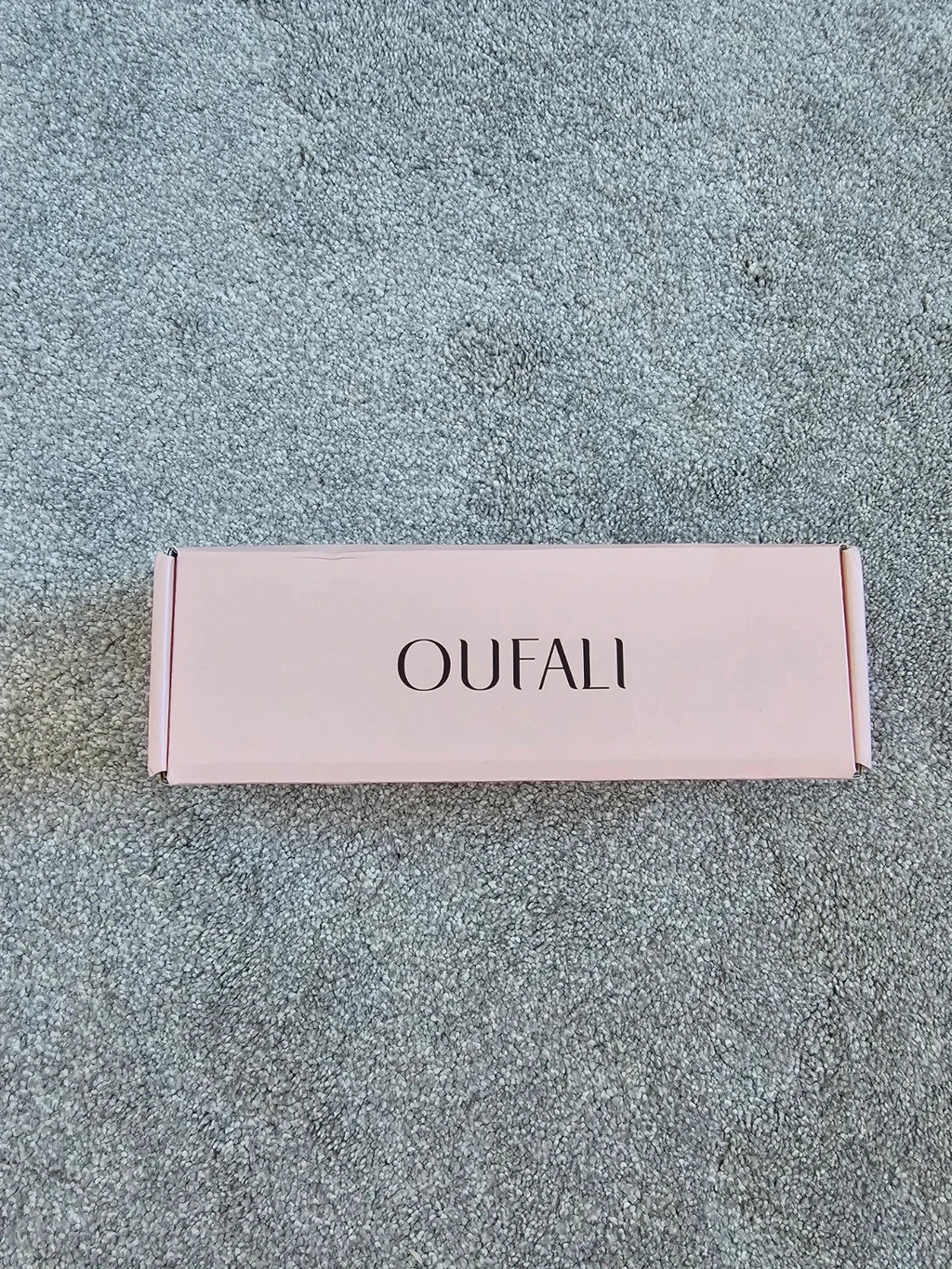 Oufali beige wireless bra seamless design with tag, no underwire for comfort.
