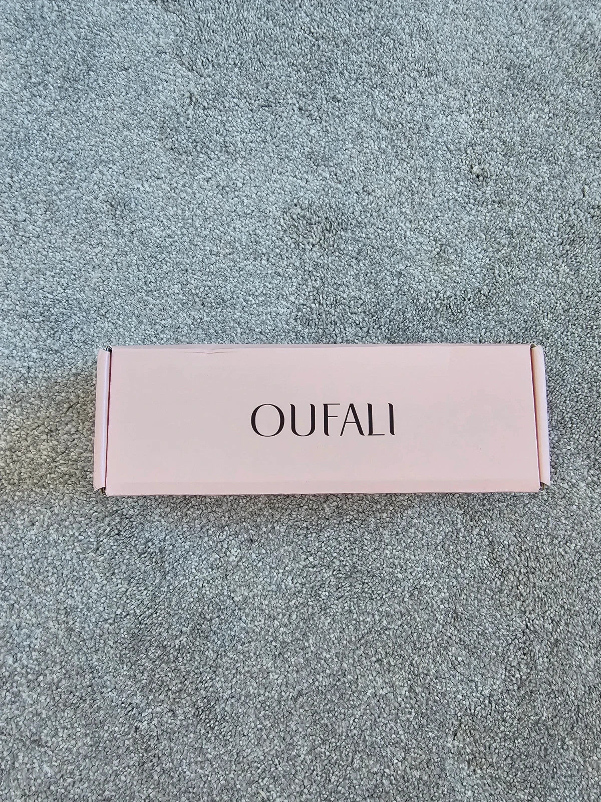 Oufali beige wireless bra seamless design with tag, no underwire for comfort.