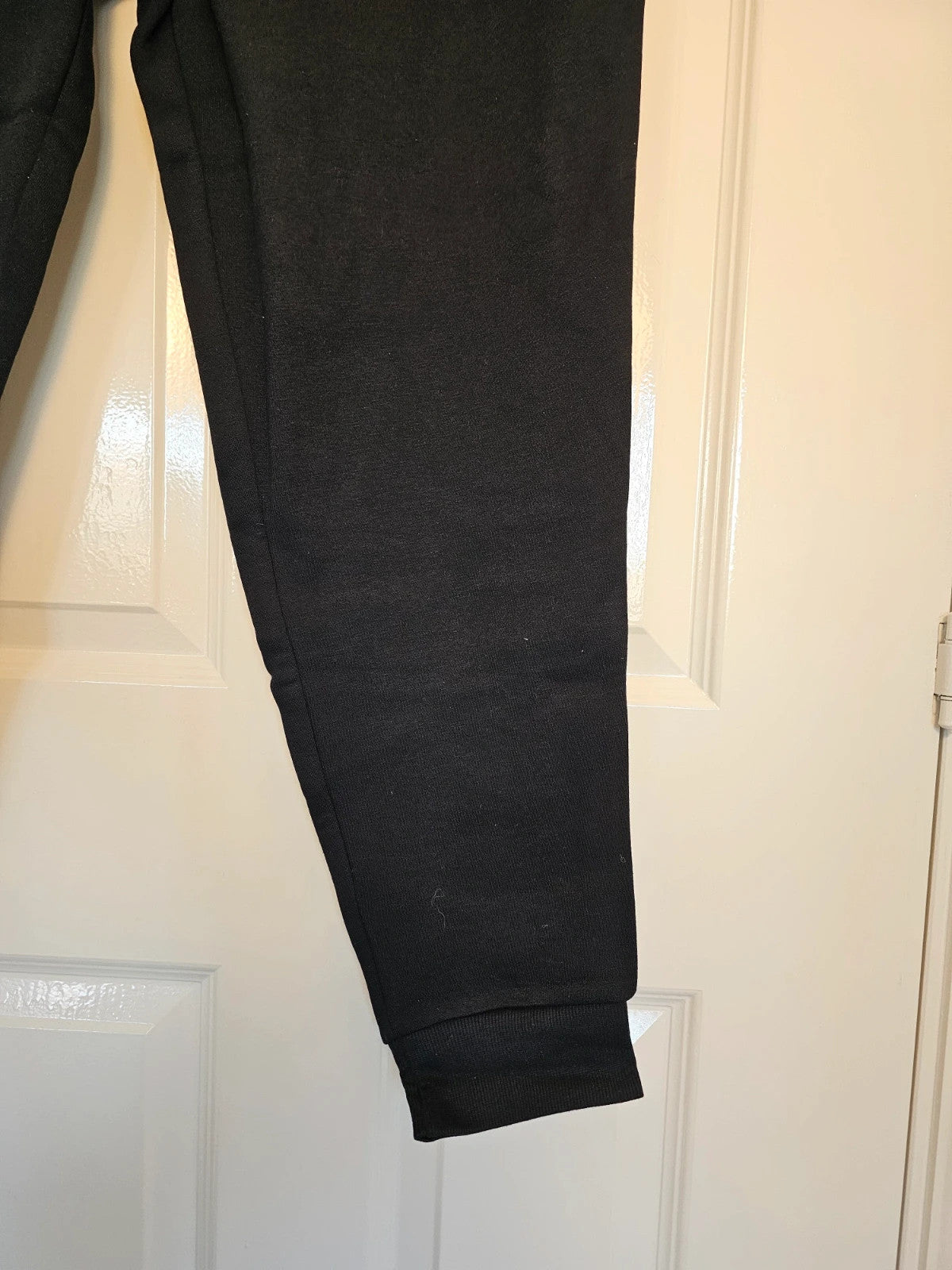 Amazon Essentials black joggers cotton blend with elastic waistband and side pockets.