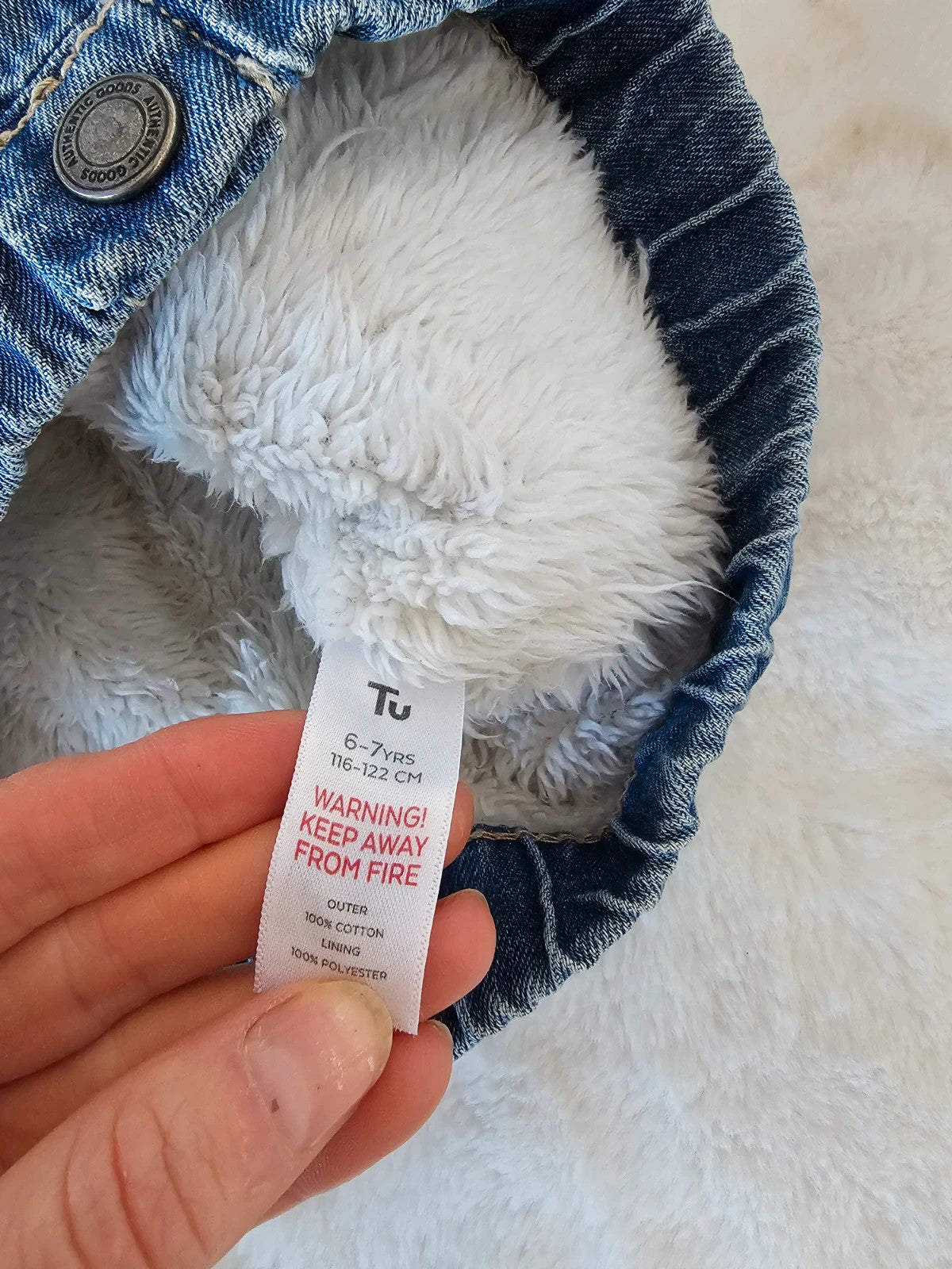 TU Kids blue denim sherpa jacket with outer collar, buttons, and pockets.