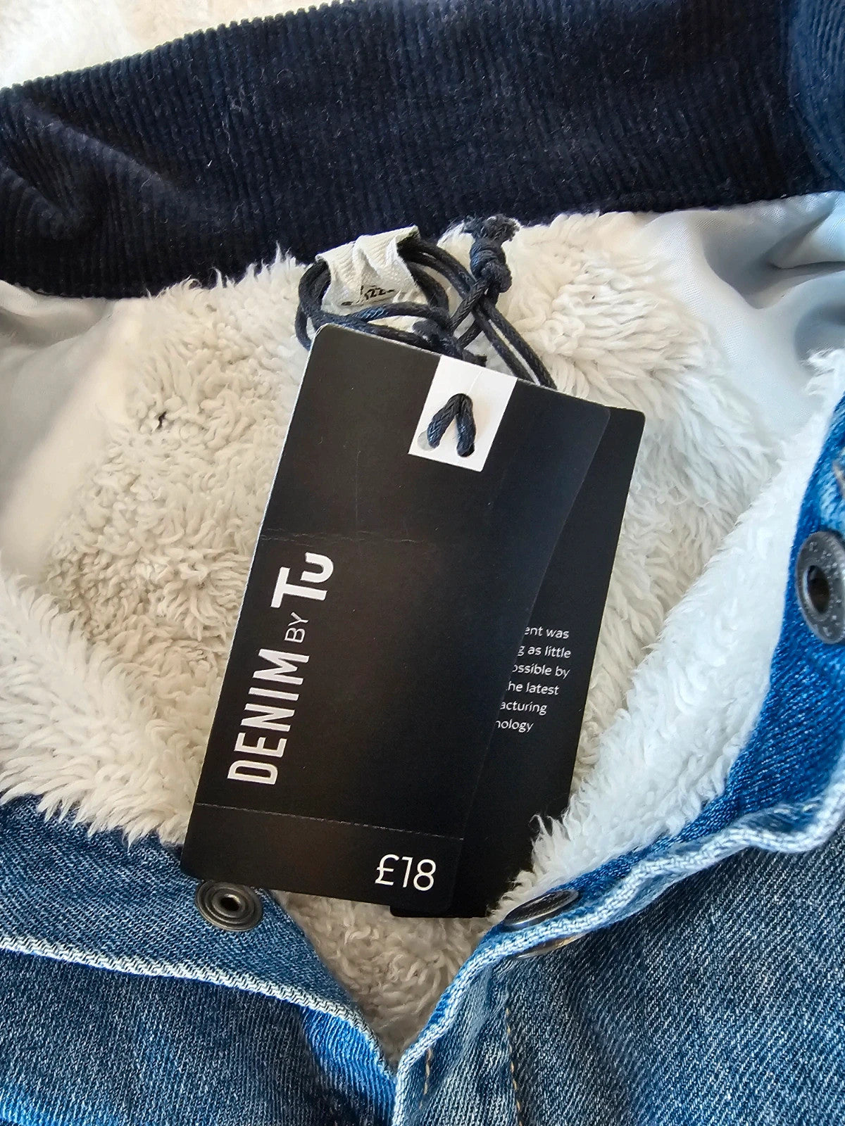TU Kids blue denim sherpa jacket with outer collar, buttons, and pockets.